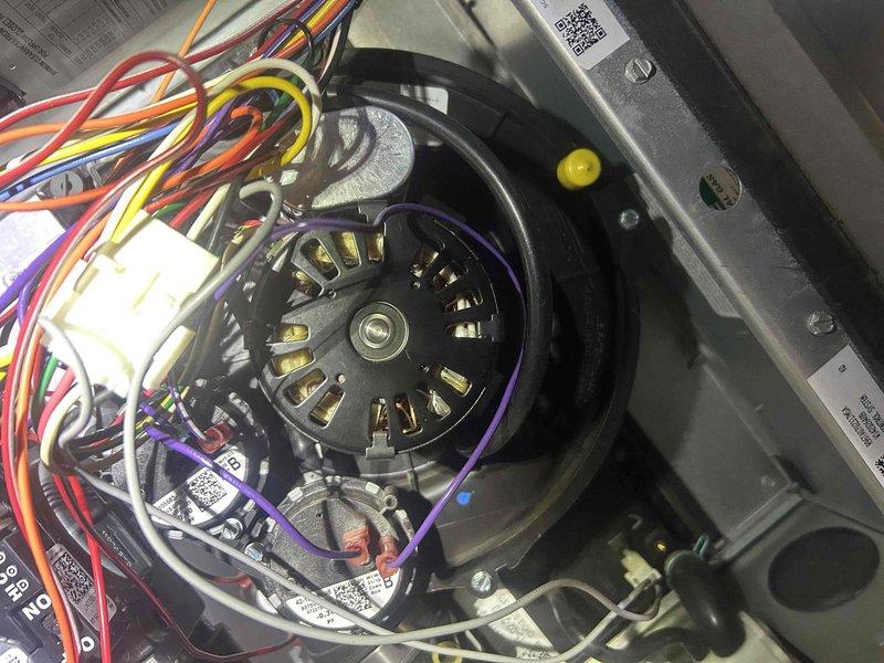 Responded to service call for system operating with loud noise, suspected to be from the inducer motor. Upon inspection, accessed and examined the blower motor assembly, which had multiple electrical connections and was properly wired. Visual inspection revealed no signs of damage or deterioration to the motor or surrounding components. System was tested and is now operating correctly without the reported noise.