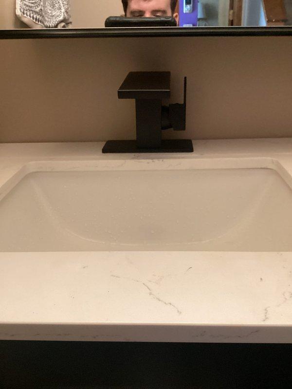 Successfully installed customer-supplied bathroom vanity sink with new P-trap assembly. Connected drain lines to existing plumbing and secured all fittings. Final inspection confirmed proper water flow and no leaks in the drainage system.