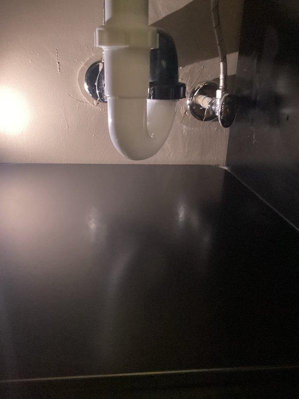 Successfully installed customer-supplied bathroom vanity sink with new P-trap assembly. Connected drain lines to existing plumbing and secured all fittings. Final inspection confirmed proper water flow and no leaks in the drainage system.