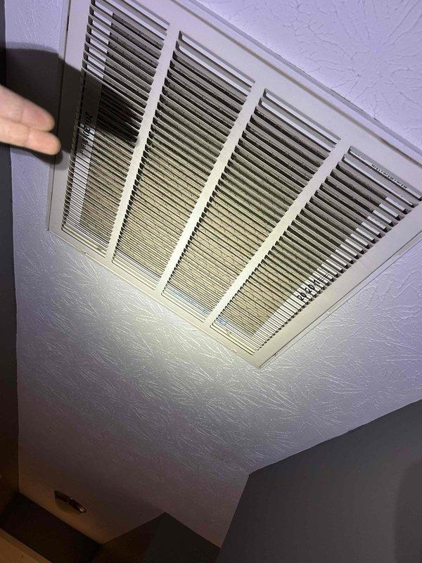 Performed Care Plan Tune Up on dual heat pump/air handler systems located in attic. Inspected and documented dirty return air grille showing dust accumulation on metal slats. Conducted electrical component inspection of control board connections and relays, verifying proper wire connections and switch functionality. Customer provided filters for service.