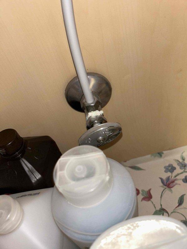 Conducted routine plumbing inspection per service agreement. Examined bathroom fixtures including wall-mounted supply lines with shut-off valve and faucet installation. Noted significant wear on faucet mounting flange with visible deterioration and color fading that may require future attention.