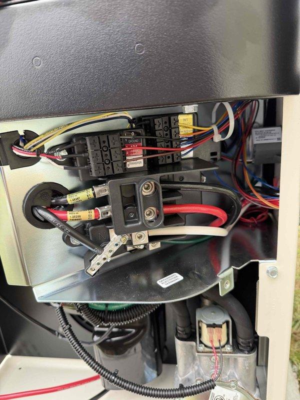Completed installation of a 26KW generator system with dual 200AMP non-service entrance transfer switches. Work included installation of an energy manager for the upstairs geothermal system, a 100AMP load shed for downstairs geothermal unit, and a 50AMP load shed for water heater. All electrical connections properly terminated and secured with appropriate wire management throughout the system.