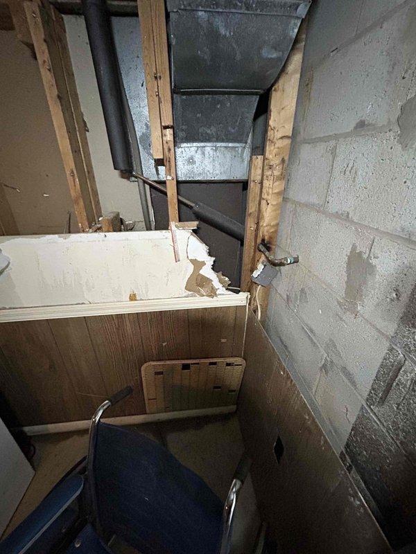 Conducted comprehensive estimate for replacement of two aging HVAC systems (27 and 40 years old) located in basement and crawlspace. Inspection revealed significant deterioration of existing equipment, including damaged metal housing, aging copper lines with inadequate insulation, and compromised ductwork. Documented structural concerns including water damage to surrounding walls and extensive degradation of wooden paneling that will need to be addressed during replacement.