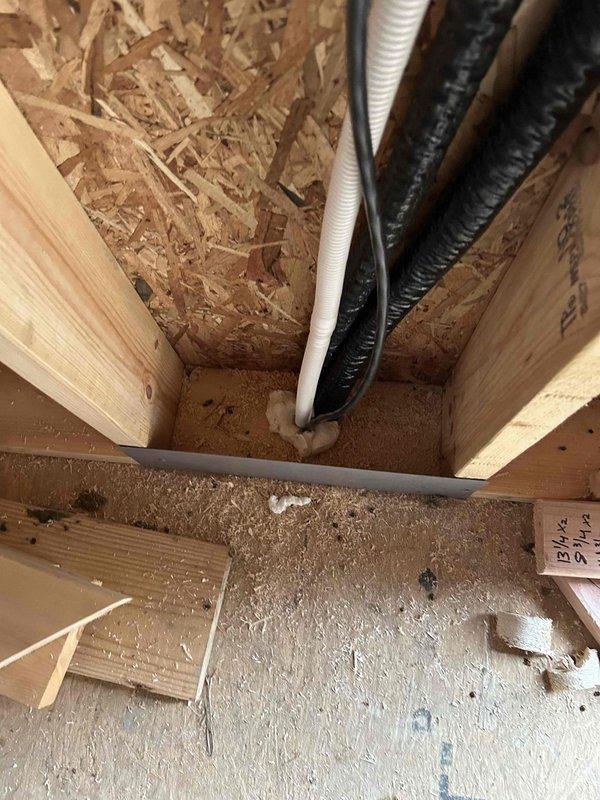 Completed installation of a Mitsubishi three-zone mini split system, featuring a 30K BTU hyper heat ductless heat pump outdoor unit with three indoor wall-mounted units (one 18K BTU and two 6K BTU blowers). All lineset piping, wiring, and drain lines were concealed in walls, with bathroom and dryer exhaust ductwork integrated into the system.