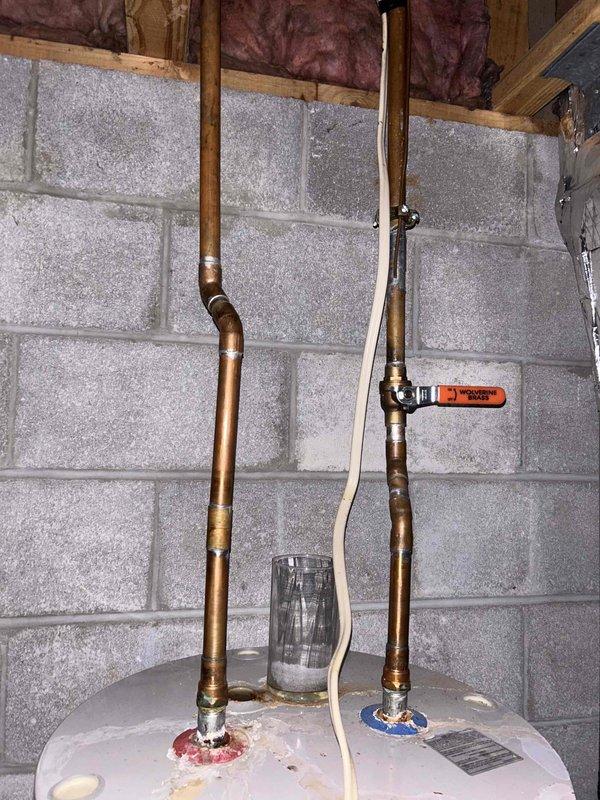 Conducted assessment on leaking A.O. Smith ProMax water heater located in basement. Unit is of undetermined age with breaker and supply valve currently turned off due to active leak. Customer seeking replacement options only. Visual inspection confirmed water heater installation against concrete block wall with copper supply lines, pressure relief valve, and treatment system present.