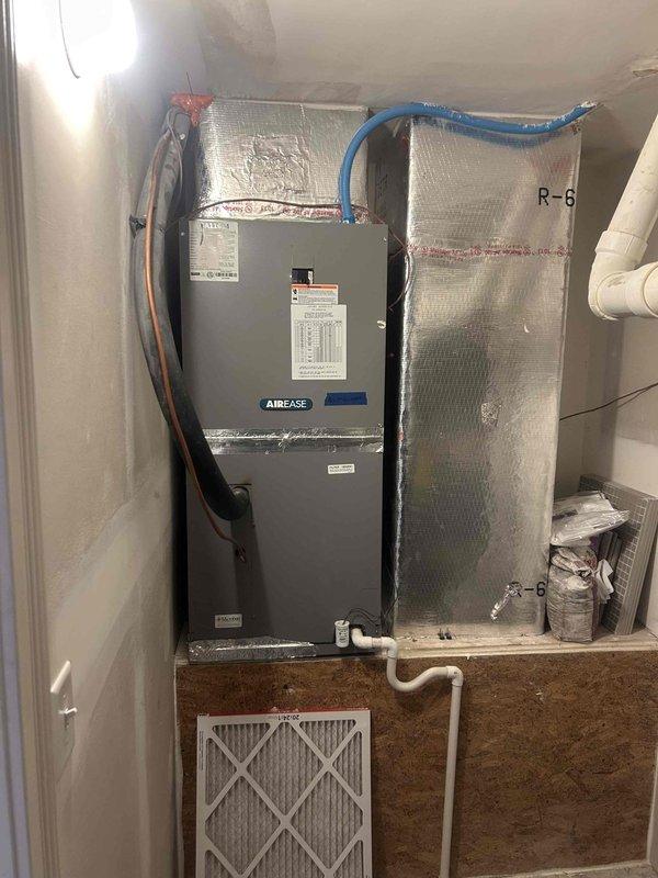 Performed evaluation of 12-year-old non-functional heat pump system for potential replacement. Assessment included inspection of outdoor AirEase units with visible weathering and the indoor air handler unit with connected R-6 insulated ductwork, condensate drainage, and electrical components. Customer has received one quote already and requests expedited replacement before year-end, with financing options to be determined based on final pricing.