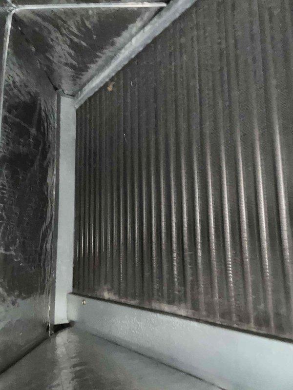 Completed seasonal tune-up on 10-year-old heat pump and air handler system located in basement. Inspected and photographed cooling coil/heat exchanger, noting some dust accumulation on the fins. Unit is due for 20x20x4 filter replacement during upcoming Fall and Spring maintenance visits.