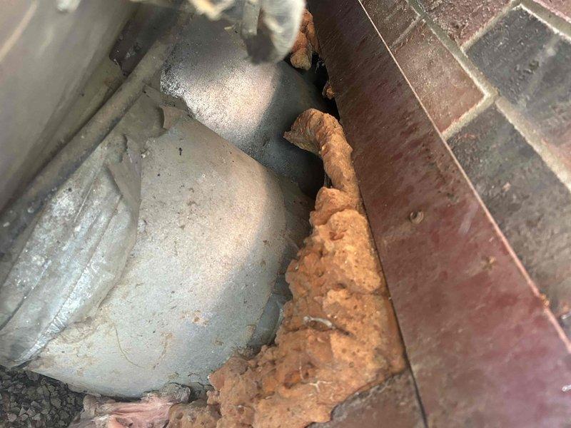 Conducted heat pump replacement estimate in crawlspace for an aging system. Customer interested in financing options with no specific brand preference and requires urgent replacement. Inspected thermostat functionality and examined foundation area where equipment connects to structure, noting potential moisture concerns at the foundation-soil interface that should be addressed during installation.