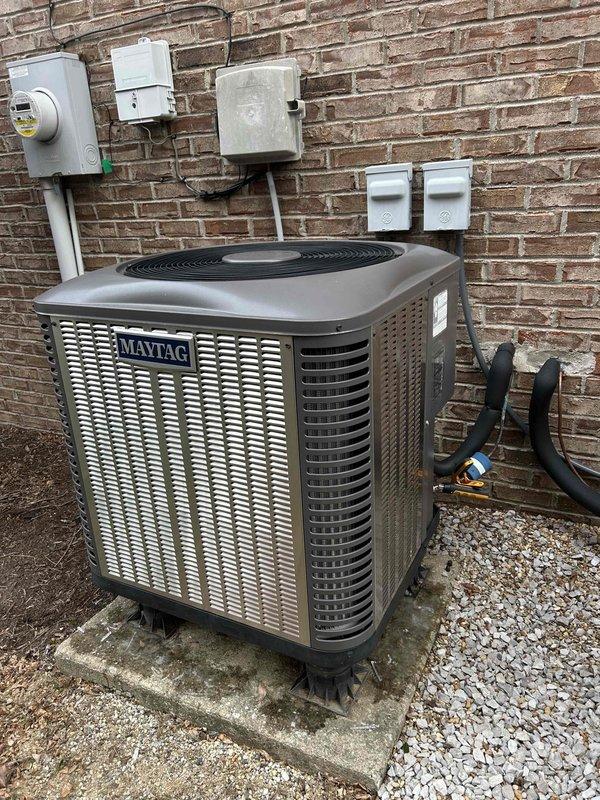 Responded to customer-reported gurgling noise from indoor unit that began after previous service call. Inspected system, including Maytag outdoor condenser unit and associated electrical components. Visual examination of the exterior equipment showed proper installation with no visible damage. Both outdoor units (Maytag and Pure) were mounted securely on concrete pads with appropriate electrical connections. Verified proper operation and addressed the refrigerant line issue causing the gurgling sound.