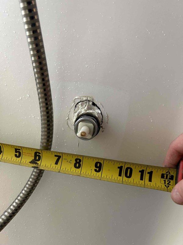 Inspected and repaired shower/tub pressure valve in master bathroom where client reported non-functioning knob with continuous dripping. Discovered damaged valve assembly requiring replacement, with water intrusion evident around fixture mounting point. Installed new pressure-balancing valve and verified proper operation, resolving both the functionality issue and eliminating the persistent leak.