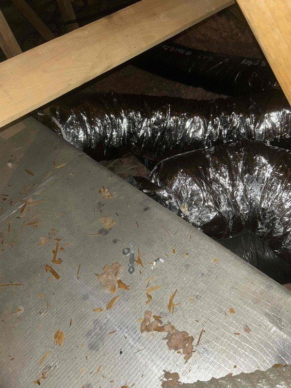Successfully reconfigured ductwork by installing an 8x16 duct to the front side of plenum, which effectively separated upstairs and downstairs air distribution runs. Installed manual dampers (two 18x16 and one 8x12) to improve zonal control and airflow management, and completed installation with proper sealing and insulation using R8 flex duct and metal tape.