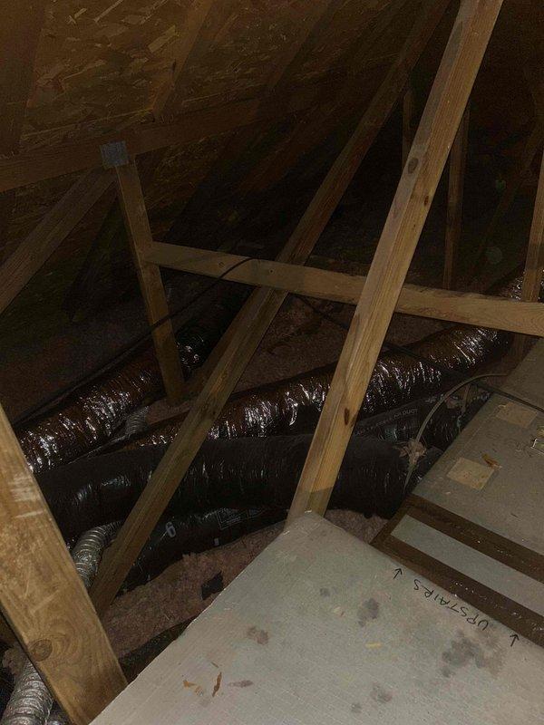 Successfully reconfigured ductwork by installing an 8x16 duct to the front side of plenum, which effectively separated upstairs and downstairs air distribution runs. Installed manual dampers (two 18x16 and one 8x12) to improve zonal control and airflow management, and completed installation with proper sealing and insulation using R8 flex duct and metal tape.