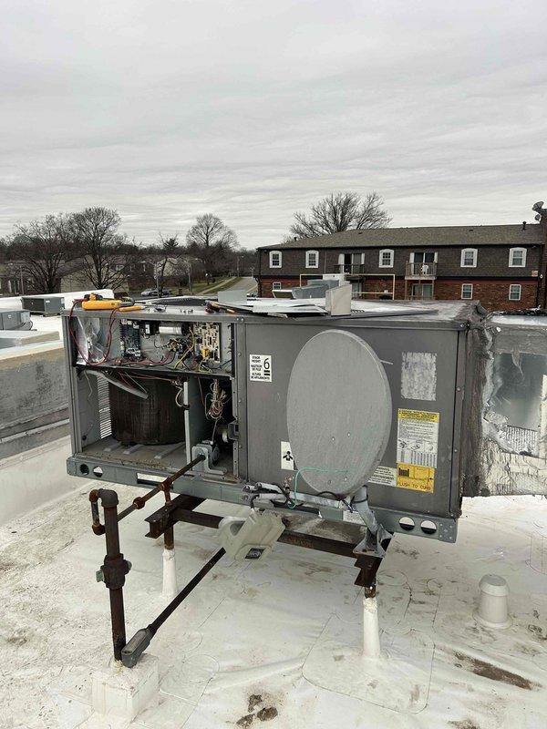 Performed commercial HVAC tune-up at bakery location using ladder to access rooftop unit (RTU). Inspected and checked Koch air filters, which were installed correctly but system showed signs of extended use with some accumulation on housing surfaces. Examined exposed internal components including wiring, coils and mechanical parts, verifying proper operation of the system.