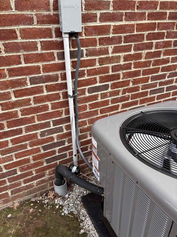 Successfully installed a complete Ruud/Rheem 2.5 ton heat pump system featuring a RP14AY30AJ2NA outdoor unit (14.3 SEER2), RH2TY3617STANNJ air handler with WWRX1502BI 15KW heat kit, and digital programmable thermostat. Installation included all necessary components: outdoor unit pad, snow legs, electrical connections, refrigerant line insulation/filter, drainage system with SS2 safety water sensor and overflow protection, and proper transition to existing ductwork.