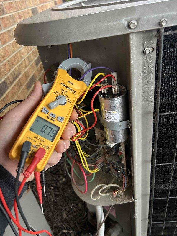 Performed comprehensive care plan tune-up on 13-year-old heat pump and air handler located in basement hallway closet. Conducted electrical diagnostics using clamp meter which showed 0.75 amp reading and measured capacitor at 4.5 microfarads. Unit is functioning within acceptable parameters with customer-supplied filter installed.