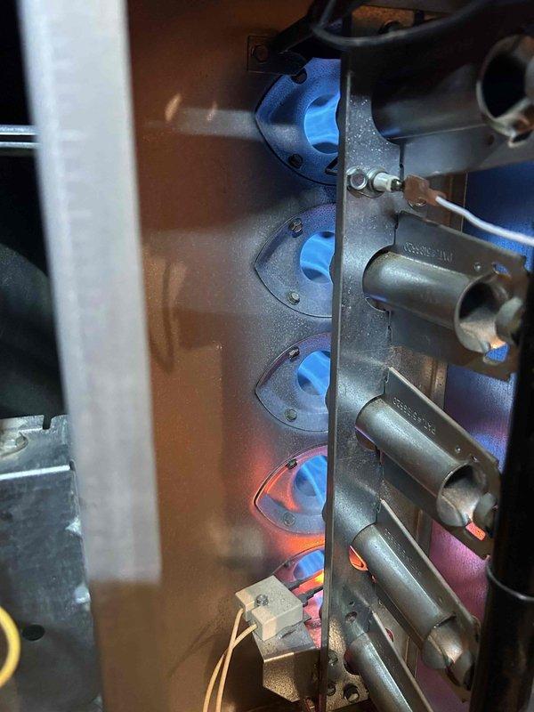 Responded to no-heat call for 20-year-old gas furnace system located in walk-in attic. Upon inspection, found heat exchanger had developed multiple cracks, compromising system safety and efficiency. Replaced heat exchanger and verified proper combustion and temperature rise across system. Unit now operating safely with normal heat output.