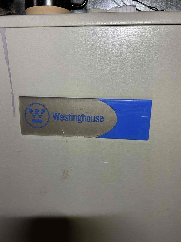 Diagnosed Westinghouse gas furnace experiencing no heat condition. Discovered condensate blockage in drain hose causing safety switch activation and preventing ignition. Cleared obstruction in drain line, verified proper drainage, and confirmed system operation with normal flame and heat output.