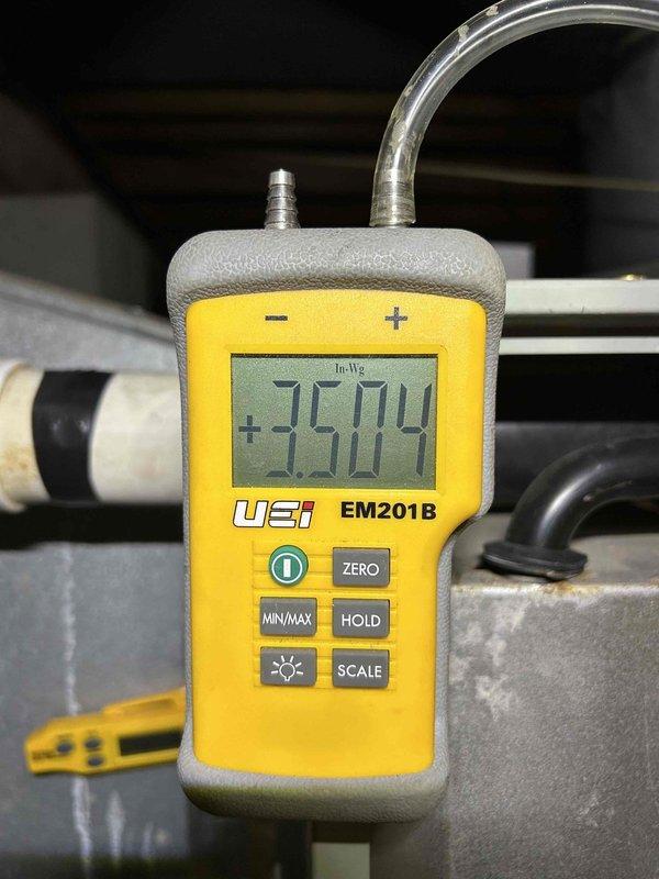 Responded to callback for system that stopped cooling after initially working post-service. Diagnosed faulty run capacitor (observed 9.5 MFD capacitor with "genteq" branding) and replaced with new unit. Static pressure tested system using UEI EM201B digital manometer, which showed +3.504 In.Wg, confirming proper system operation after repair. System is now cooling effectively.