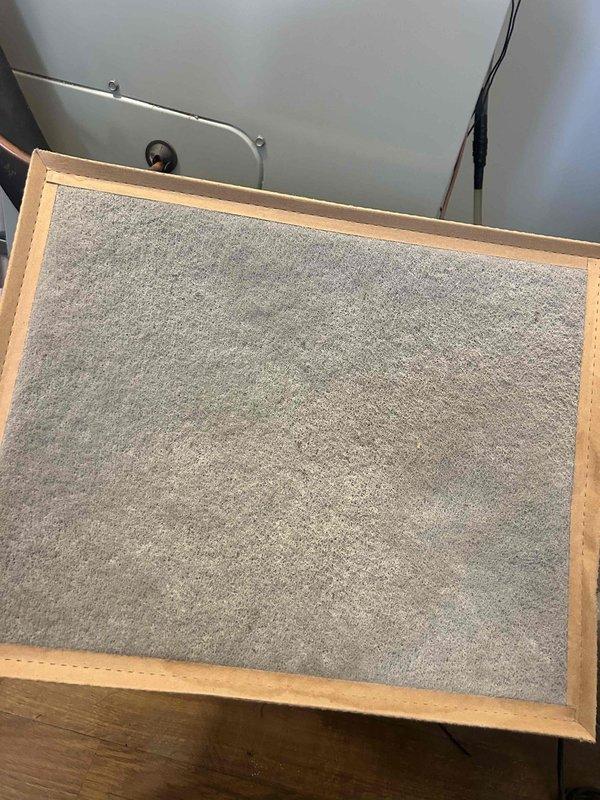 Responded to E3 error code on basement HVAC system by replacing humidifier filter #35 as requested. Inspected upstairs unit where temperature was not maintaining setpoint (reading 81°F), indicating possible thermostat malfunction. Documented condition of evaporator coil and filtration components through photos for follow-up service.