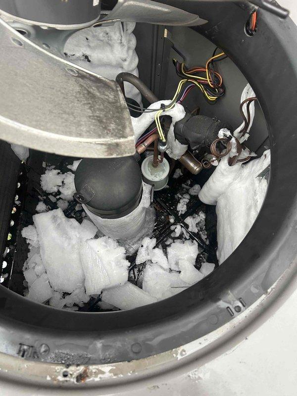 Responded to customer request regarding system performance issues. Upon inspection, discovered significant ice formation on the evaporator coil indicating restricted airflow and possible refrigerant problems. Additionally noted sagging flexible ductwork in the crawlspace requiring proper support. Performed coil defrosting and cleaning, secured loose ductwork with appropriate strapping, and restored system to proper working order.