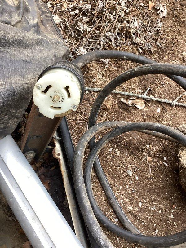 Performed detailed assessment of existing electrical panel for portable generator hookup installation. Inspected main breaker panel components and circuit capacity to determine appropriate connection points. Evaluated existing wiring configuration and identified suitable location for transfer switch or interlock kit. Examined outdoor area where generator will be positioned and assessed power cord routing requirements for safe operation during power outages.