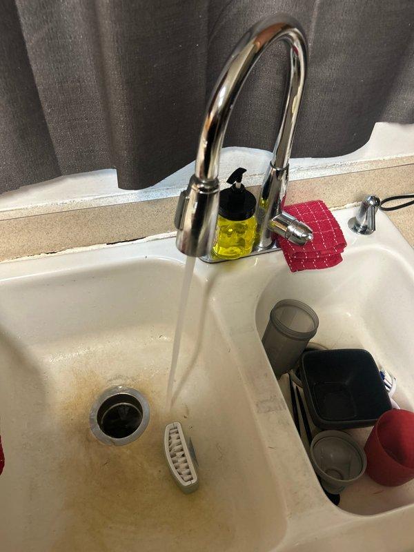 Completed routine plumbing inspection as part of customer's care plan. Identified constant drip issue in main bathroom bathtub faucet. Also inspected kitchen sink faucet functionality and water heater installation, noting proper water flow and confirming all connections to the Whirlpool water heater are secure with no visible leaks.