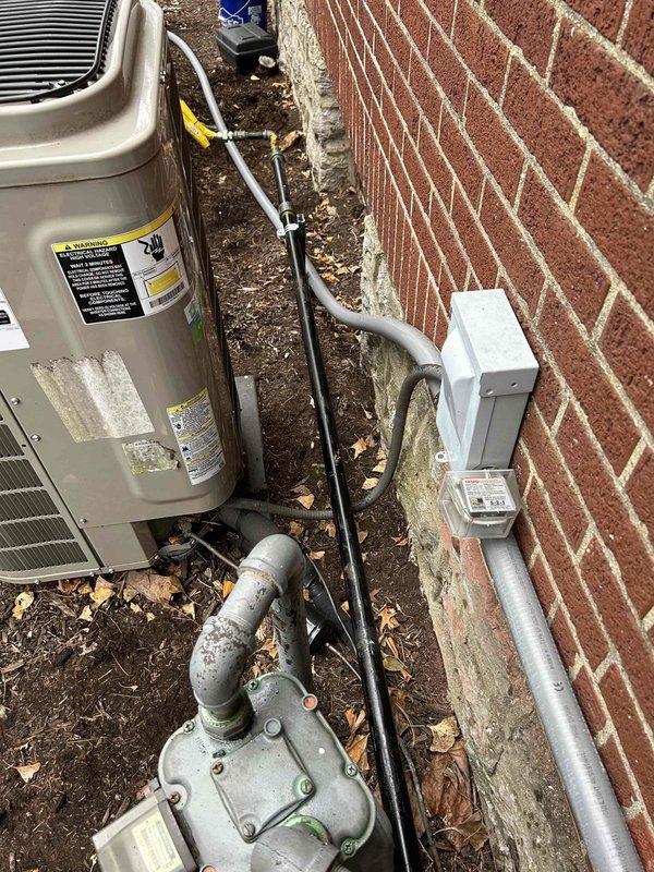 Successfully completed gas piping installation to generator, connecting from the main gas meter with proper pipe fittings and ensuring secure, leak-free connections. Installed appropriate regulator system against exterior brick wall with weather-resistant components and verified proper gas flow to support generator operation.