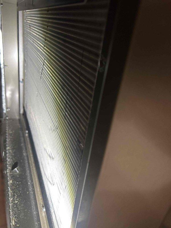 Performed scheduled maintenance on 3-year-old geothermal system. Inspected capacitor connections and verified proper rating (40μF 5% at 370VAC). Examined cooling coil condition; noted normal condensation present with no significant dust accumulation or fin damage. Customer self-maintains steam humidifier; EAC was also inspected during service.