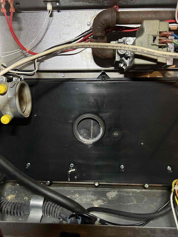 Successfully installed a new inducer motor and condensation pump in the customer's HVAC system. Visual inspection confirmed proper installation with all electrical connections securely fastened and components mounted correctly to the unit's housing panel.