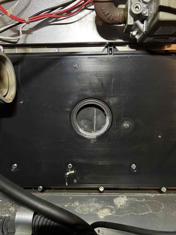 Successfully installed a new inducer motor and condensation pump in the customer's HVAC system. Visual inspection confirmed proper installation with all electrical connections securely fastened and components mounted correctly to the unit's housing panel.