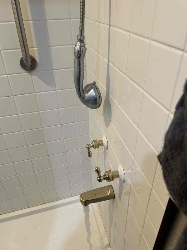 Performed a comprehensive 60-point plumbing inspection service. Examined bathroom shower/tub fixtures, including showerhead, diverter valve, and tub spout, noting normal wear but confirming proper functionality. Inspected valve stem/cartridge connection points for signs of leakage or deterioration. All components appear to be in serviceable condition with no immediate issues requiring attention.
