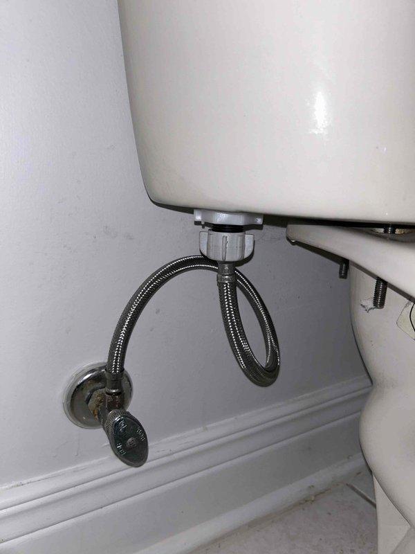 Conducted routine plumbing inspection of toilet fixture as requested through PSA. Examined interior tank components showing normal mineral buildup and wear, and verified integrity of the stainless steel braided water supply line and wall connection. No immediate issues requiring repair were identified.