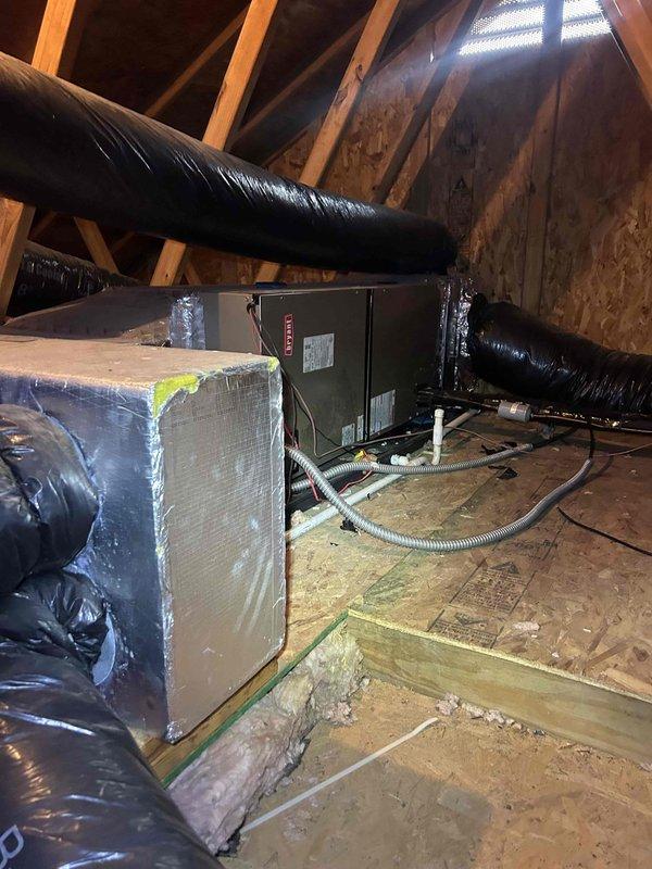 Performed scheduled maintenance on residential HVAC system with attic-mounted air handler. Inspected and confirmed proper operation of Honeywell ProSeries smart thermostat (displaying 67°F with 40% battery). System running efficiently with all ductwork properly sealed and insulated.