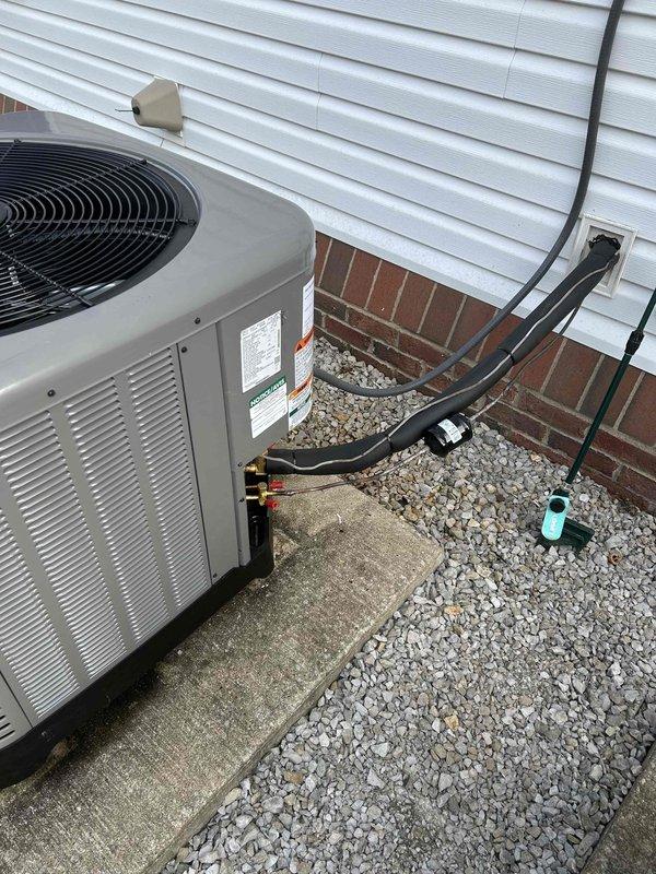 Successfully installed a complete Rheem/RUUD 2.5 ton 14.3 SEER2 heat pump system with RUUD air handler and 15KW heat kit. Utilized existing components including thermostat, concrete pad, disconnect box, auxiliary pan, and filter return grille while properly connecting refrigerant lines with insulation and installing safety features including SS2 coil drain sensor.