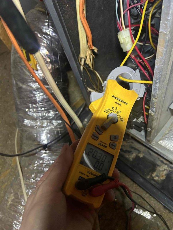 Performed comprehensive HVAC tune-up service including electrical system inspection. Conducted amperage measurements on electrical components using Fieldpiece SC440 clamp meter, recording readings of 203.0A and 195.8A on various circuits. Inspected wiring connections, noting some wear on insulation that may require future attention.