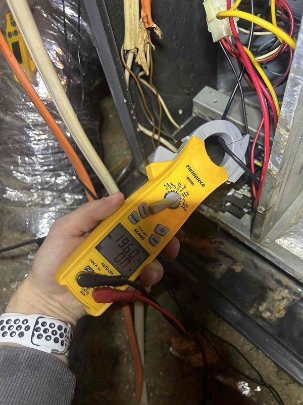 Performed comprehensive HVAC tune-up service including electrical system inspection. Conducted amperage measurements on electrical components using Fieldpiece SC440 clamp meter, recording readings of 203.0A and 195.8A on various circuits. Inspected wiring connections, noting some wear on insulation that may require future attention.