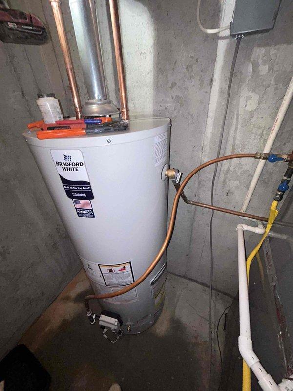 Completed installation of a Bradford White 50-gallon gas water heater with a 6-year tank/parts warranty and 1-year labor warranty. Removed and disposed of existing unit, reconnected to existing water piping with new fittings, and established proper electrical connections. Installation was performed to code standards with proper venting, and all necessary permits were obtained and inspections completed.