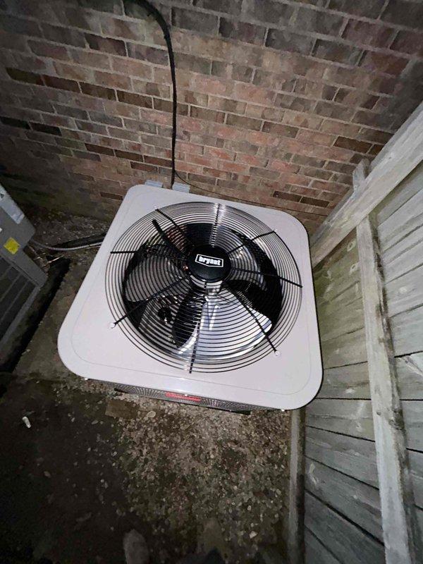 Completed installation of a Bryant Preferred Series Two Stage Heat Pump system featuring an 18 SEER2 2-ton outdoor unit and variable speed air handler with 10KW heat kit. Removed old existing air handler from deeper section of crawl space and installed new air handler in crawl space with proper transitions to existing ductwork. System includes safety components such as SS2 coil drain sensor, proper refrigerant line insulation, and filter.