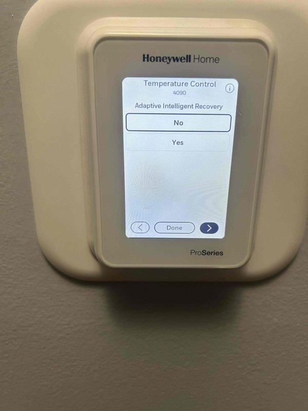 Responded to non-urgent service call regarding uneven heating with reported 10-degree temperature difference between areas of home. Inspected Honeywell Home ProSeries thermostat (model 3310) and adjusted Temperature Balancing Room Delta setting to improve temperature distribution. Additionally, enabled Adaptive Intelligent Recovery feature in thermostat settings to optimize system performance and create more consistent heating throughout the residence.