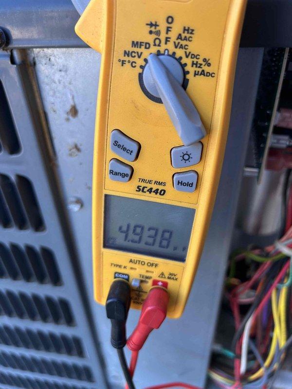 Performed scheduled Care Plan tune-up on customer's gas furnace and heat pump system. Conducted full inspection and operational testing with multimeter showing proper voltage readings (493.8V) across electrical components. Verified proper flame pattern and combustion in burner assembly. Customer was provided with requested quote for UV light replacement.