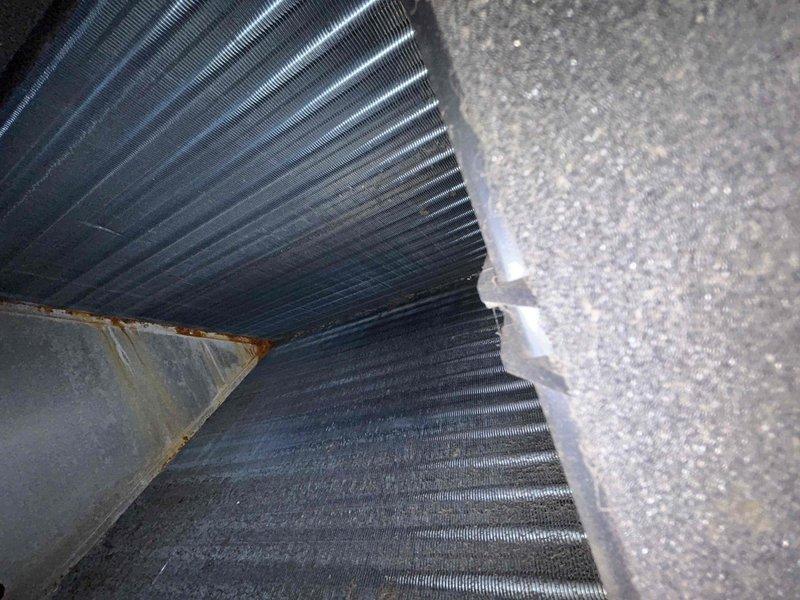 Responded to customer's no heat complaint for a 7-year-old electric HVAC system located in crawlspace. Inspection revealed contaminated evaporator coils requiring cleaning and electrical issues at the circuit panel that were affecting system operation. Performed thorough cleaning of cooling coils and repaired faulty wiring connections to restore proper heating function.