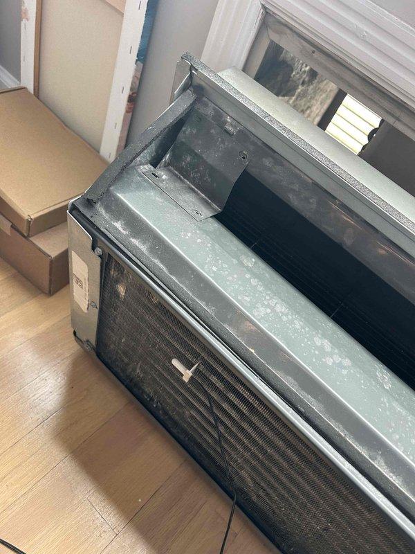 Responded to service call for 7-year-old PTAC electric heating unit blowing cool air. Upon inspection, found significant dust accumulation on exterior housing and compromised heating coil assembly. Cleaned unit thoroughly and replaced defective heating element, restoring proper heat function.