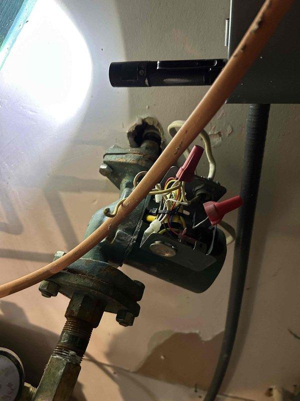 Repaired water leak at water heater by replacing corroded copper supply line connection and green valve assembly showing significant oxidation. Installed new PVC pipe with proper primer and cement at joint connection to resolve steady leak. System tested after repair with water restored to confirm proper operation with no further leakage.