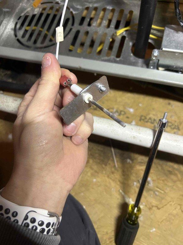 Responded to emergency no-heat call for furnace system less than 5 years old. Diagnosed faulty igniter as root cause of heating failure, evidenced by visual inspection of the component. Replaced igniter assembly and verified proper system operation before concluding service.