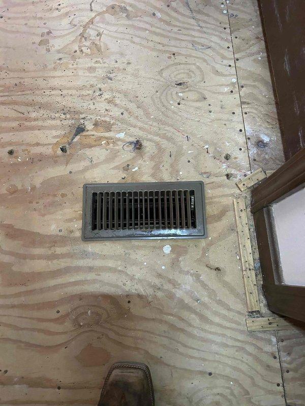 Responded to a non-urgent service call where customer reported a vent cover that had fallen into the ductwork. Upon inspection, located the affected floor register and documented the condition of surrounding plywood flooring. Replaced the missing vent cover with a suitable 14x29 size floor register and installed a new 14x29 air filter as requested by customer.
