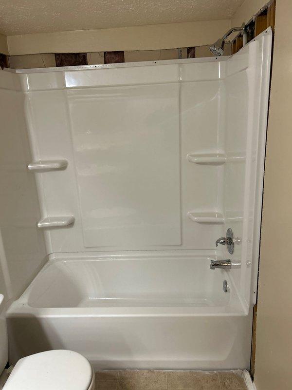 Successfully completed installation of a 30x60 left hand white tub with Delta body faucet/chrome trim, new shower valve, and Delta chrome tub spout. Removed existing tile/knockdown walls and installed new knockdown walls as specified. Installed Watco waste & overflow assembly and completed all necessary water and drain connections with functional testing confirmed by verifying proper drainage and water flow.