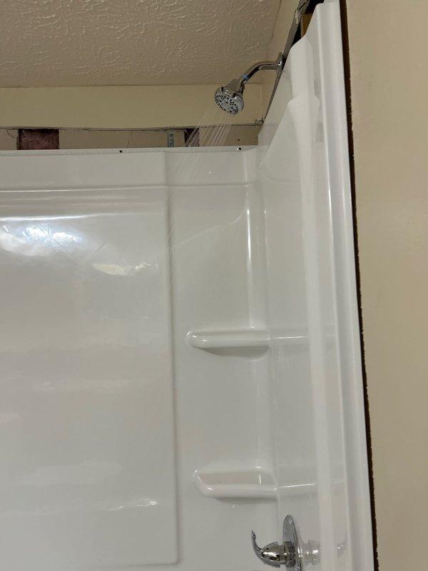 Successfully completed installation of a 30x60 left hand white tub with Delta body faucet/chrome trim, new shower valve, and Delta chrome tub spout. Removed existing tile/knockdown walls and installed new knockdown walls as specified. Installed Watco waste & overflow assembly and completed all necessary water and drain connections with functional testing confirmed by verifying proper drainage and water flow.