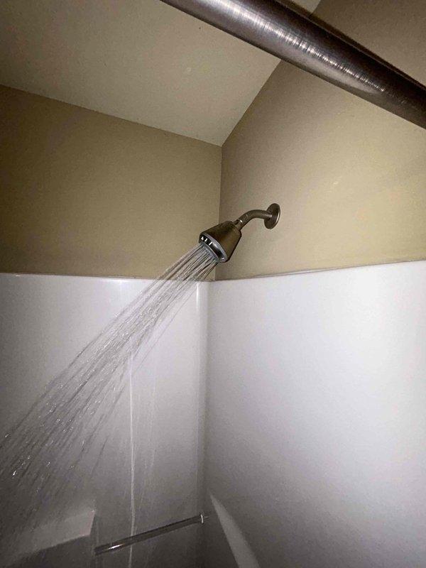 Performed routine plumbing inspection with focus on aging water heater as requested. Thoroughly examined water heater, noting proper operation but signs of age-related wear. Tested shower functionality and water pressure, which demonstrated normal operation. Inspected all visible plumbing connections and confirmed no active leaks present in the mechanical area where water heater is installed.