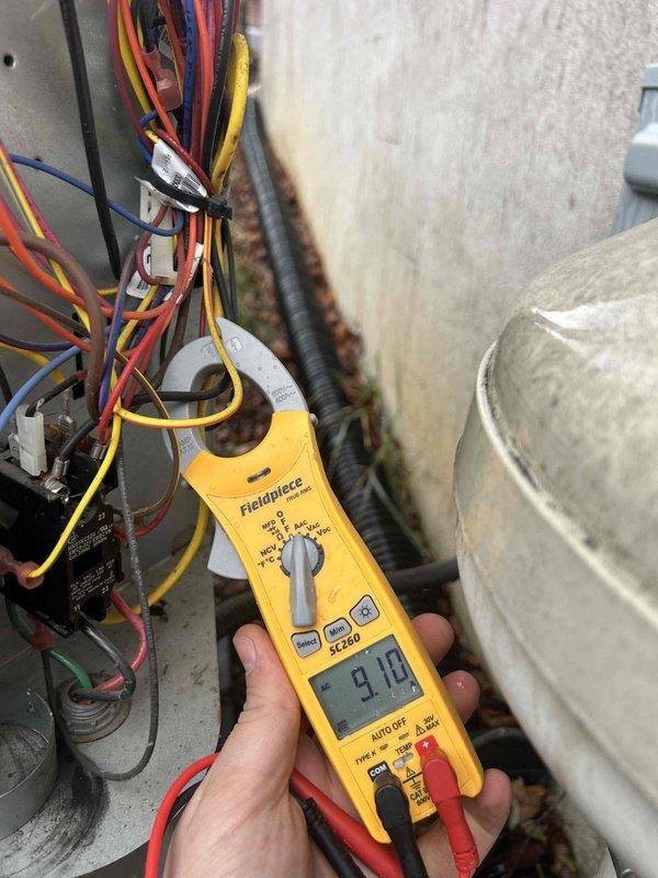 Performed routine care plan tune-up on heat pump/air handler system located in attic (garage access). Inspected electrical components including capacitor and verified proper connections. Conducted amperage measurements with clamp meter, confirming system is operating within specifications. Cleaned washable 16x25x1 filter as part of maintenance protocol.