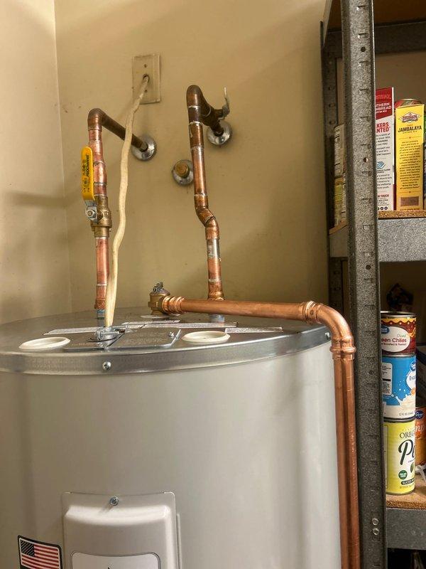 Completed installation of new 50-gallon electric short water heater, including removal and disposal of old unit. Installed new copper piping with sweat fittings, connected electrical components, and verified system for proper functionality and absence of leaks before completing the job.